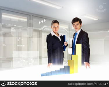 Business and innovation technologies. young businesspeople looking at graph of high-tech image