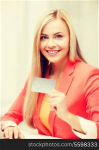 business and internet concept - smiling businesswoman with laptop using credit card