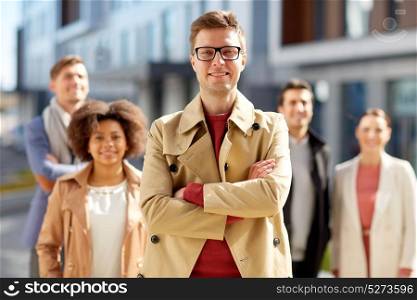 business and leadership concept - international group of people on city street. international group of people on city street