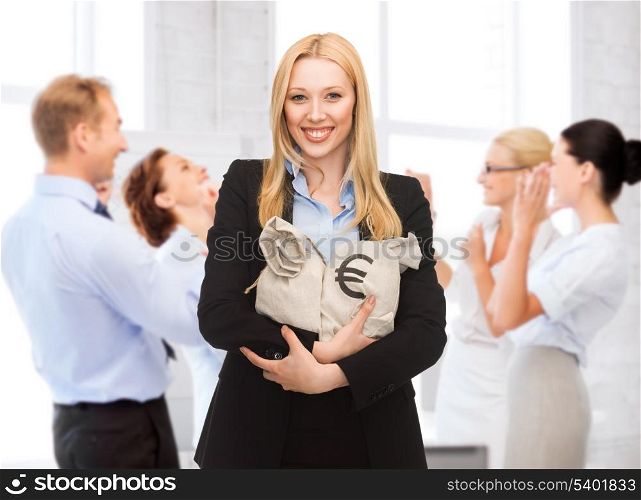 business and money - businesswoman holding money bags with euro