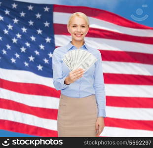 business and money concept - smiling businesswoman with dollar cash money