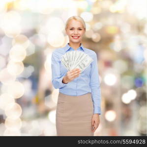 business and money concept - smiling businesswoman with dollar cash money