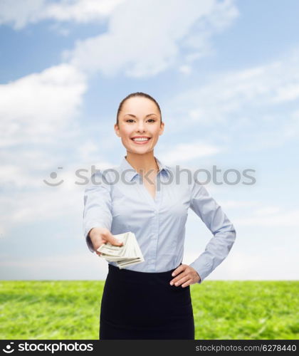 business and money concept - young businesswoman with dollar cash money