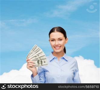 business and money concept - young businesswoman with dollar cash money over blue sky with white cloud background