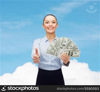 business and money concept - young businesswoman with dollar cash money showing thumbs up