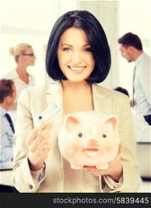 business and money saving concept - woman with piggy bank and cash money. woman with piggy bank and cash money
