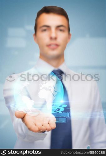 business and office, advertising, people concept - friendly young buisnessman showing globe on the palm of his hand