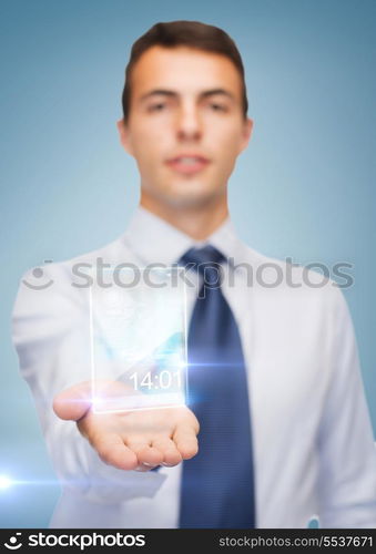 business and office, advertising, people concept - friendly young buisnessman showing transparent phone on the palm of his hand