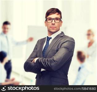 business and office concept - attractive buisnessman or teacher in glasses