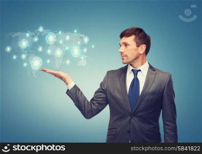 business and office concept - attractive buisnessman or teacher showing world map hologram on the palm