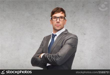business and office concept - attractive businessman or teacher in glasses