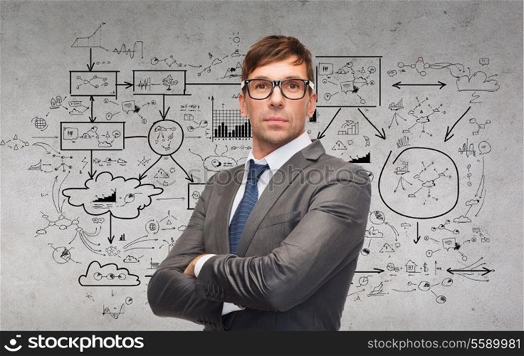 business and office concept - attractive businessman or teacher in glasses with big plan on the back