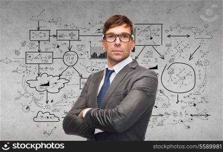 business and office concept - attractive businessman or teacher in glasses with big plan on the back