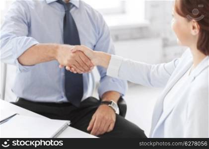 business and office concept - business people shaking hands in office