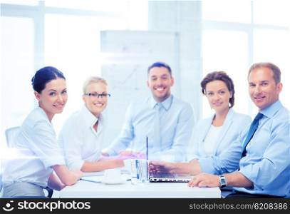 business and office concept - business team having meeting in office. business team having meeting in office