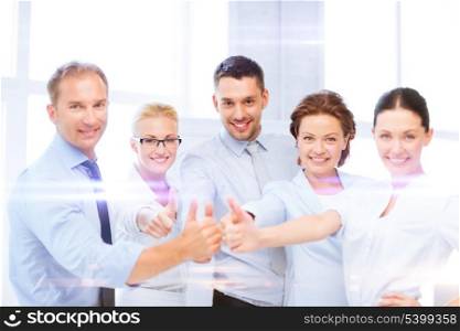 business and office concept - business team showing thumbs up in office