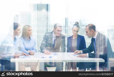 business and office concept - business team with documents having discussion in office. business team with documents having discussion