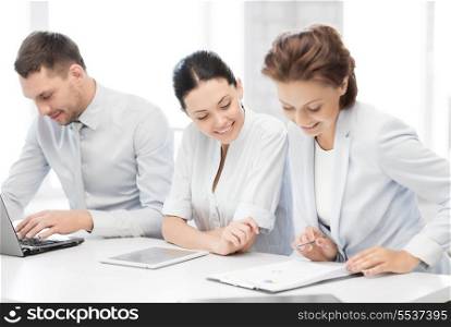 business and office concept - business team working with tablet pc and laptop in office