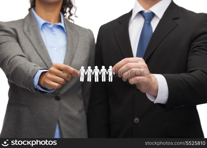 business and office concept - businessman and businesswoman holding paper team