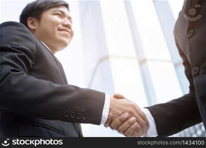 business and office concept - businessman shaking hands