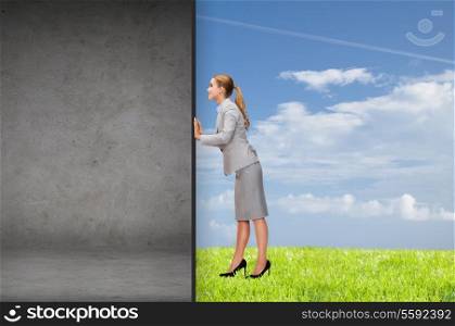 business and office concept - businesswoman pushing away concrete wall