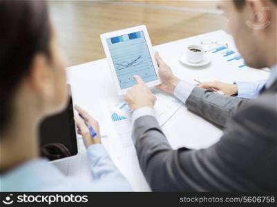business and office concept - close up of business team with graph on tablet pc screen and coffee in office
