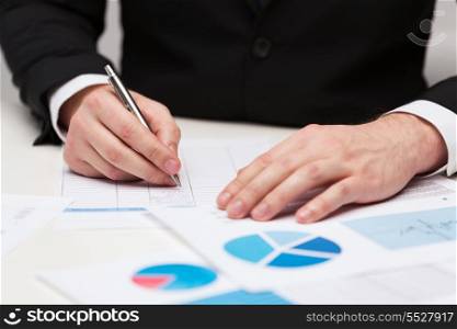 business and office concept - close up of businessman with papers