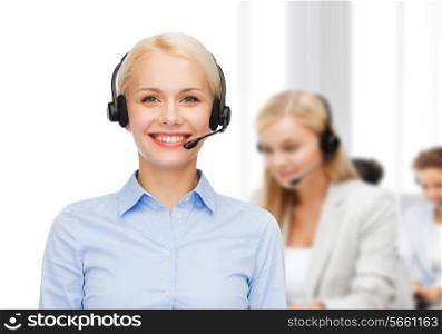 business and office concept - friendly female helpline operator with headphones
