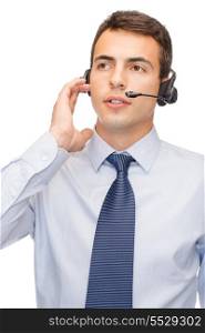 business and office concept - friendly male helpline operator with headphones