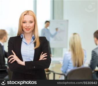 business and office concept - friendly young smiling businesswoman at office