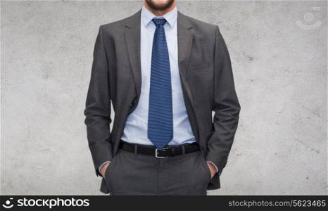 business and office concept - handsome buisnessman in suit
