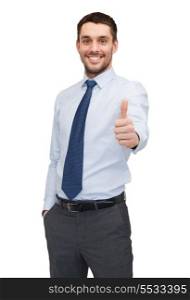business and office concept - handsome buisnessman showing thumbs up