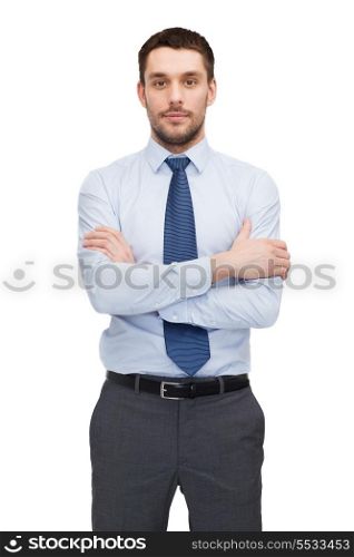 business and office concept - handsome buisnessman with crossed arms
