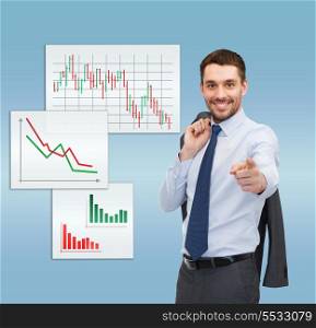 business and office concept - handsome buisnessman with jacket over shoulder pointing finger at you