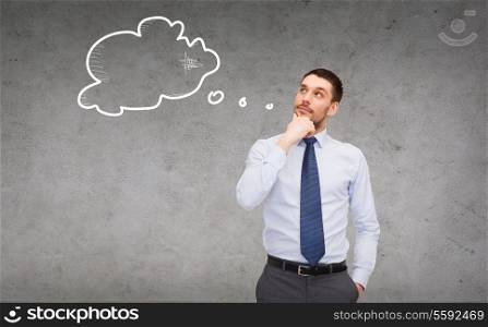 business and office concept - handsome businessman looking up at text bubble