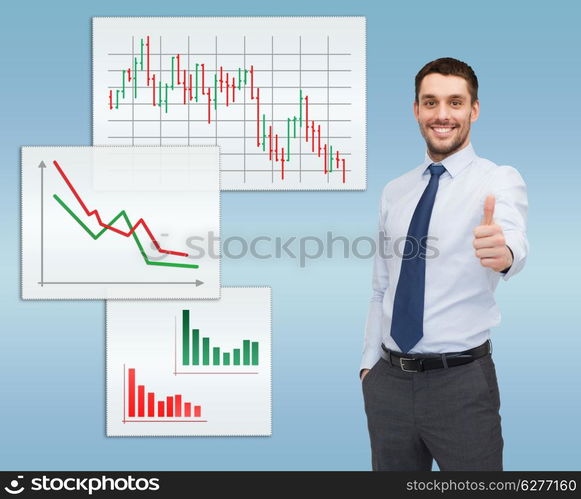 business and office concept - handsome businessman showing thumbs up