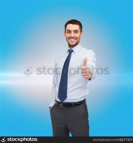 business and office concept - handsome businessman showing thumbs up