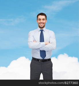 business and office concept - handsome businessman with crossed arms