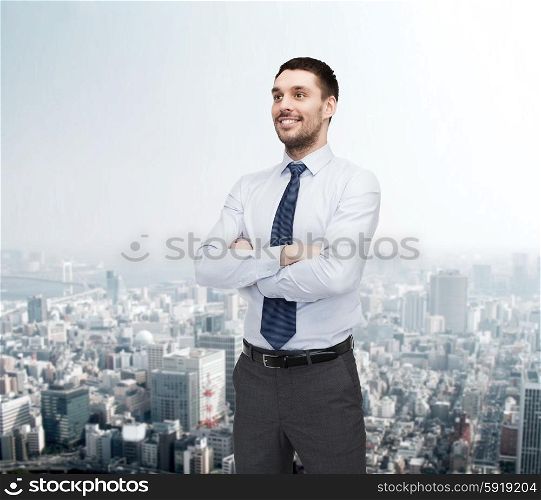 business and office concept - handsome businessman with crossed arms. handsome businessman with crossed arms