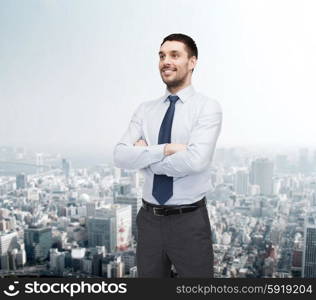 business and office concept - handsome businessman with crossed arms. handsome businessman with crossed arms