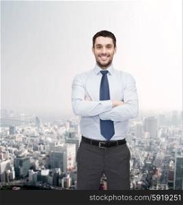 business and office concept - handsome businessman with crossed arms. handsome businessman with crossed arms