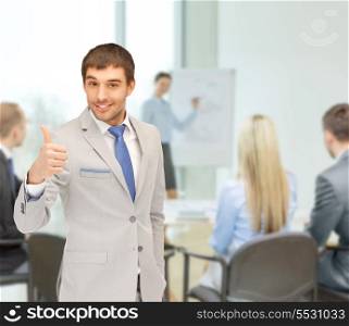 business and office concept - handsome man with thumbs up