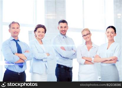 business and office concept - picture of friendly business team in office. friendly business team in office