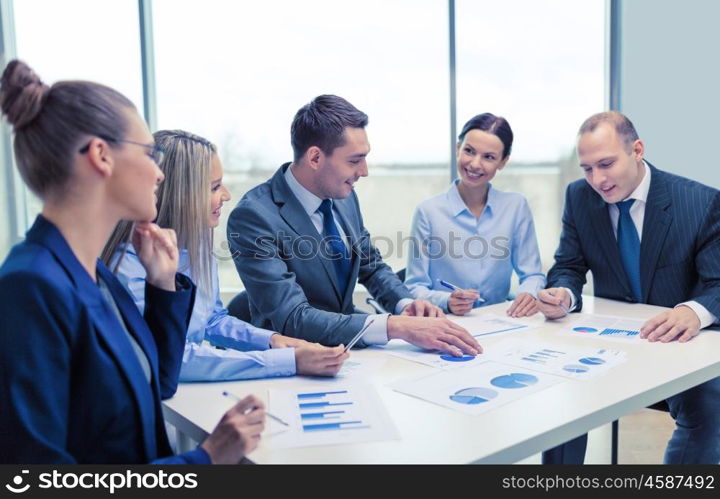 business and office concept - smiling business team at meeting. smiling business team at meeting