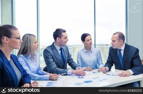 business and office concept - smiling business team at meeting. smiling business team at meeting