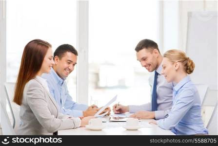 business and office concept - smiling business team having meeting in office