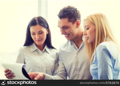 business and office concept - smiling business team looking at clipboard