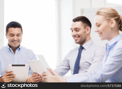 business and office concept - smiling business team working with tablet pc computers in office