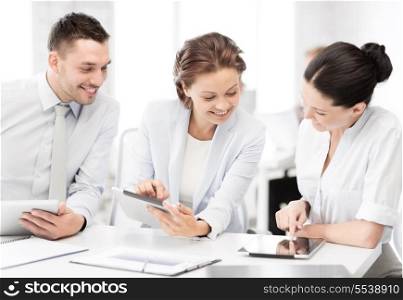 business and office concept - smiling business team working with tablet pcs in office