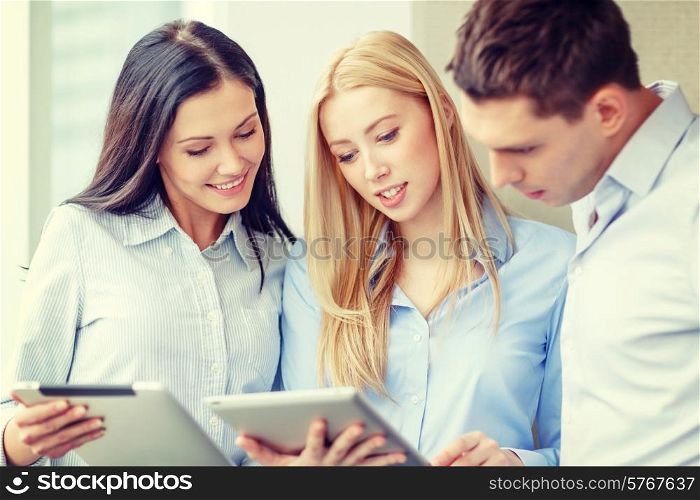 business and office concept - smiling business team working with tablet pcs in office